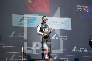 2021-03-28 - Zhou Guanyu (chn), UNI-Virtuosi Racing, Dallara F2, portrait win celebration podium during the 1st round of the 2021 FIA Formula 2 Championship from March 26 to 28, 2021 on the Bahrain International Circuit, in Sakhir, Bahrain - Photo Florent Gooden / DPPI - 1ST ROUND OF THE 2021 FIA FORMULA 2 CHAMPIONSHIP - FORMULA 2 - MOTORS