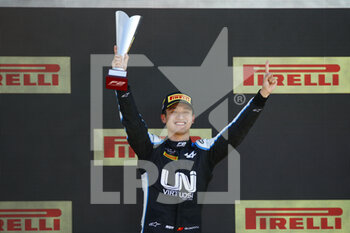 2021-07-18 - Zhou Guanyu (chn), UNI-Virtuosi Racing, Dallara F2, portrait celebrating his victory at the podium during the 4th round of the 2021 FIA Formula 2 Championship from from July 16 to 18, 2021 on the Silverstone Circuit, in Silverstone, United Kingdom - Photo Xavi Bonilla / DPPI - 4TH ROUND OF THE 2021 FIA FORMULA 2 CHAMPIONSHIP - FORMULA 2 - MOTORS