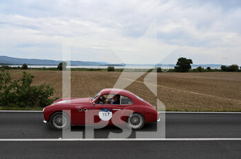 2021-06-18 - A car passes by the Trasimeno lake in during the third leg of the Mille Miglia 2021  on june 18, 2021 in Trasimeno Lake, Italy. Photo by Umberto Favretto/New Reporter - MILLE MIGLIA 2021  - HISTORIC - MOTORS