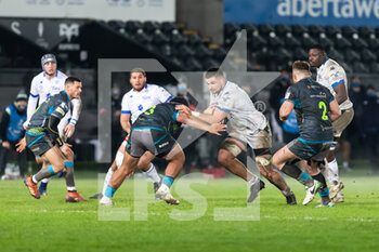 2020-12-12 - Castres' number 8 Dorian Clerc under pressure from Ospreys' prop Ma'afu Fia during the European Rugby Challenge Cup, rugby union match between Ospreys and Castres on December 12, 2020 at the Liberty Stadium in Swansea, Wales - Photo Dan Minto / ProSportsImages / DPPI - OSPREYS VS CASTRES - CHALLENGE CUP - RUGBY