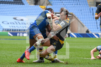 2021-04-03 - Wasps wing Josh Bassett (11) is tackled by ASM Clermont Auvergne wing Alivereti Raka (11) during the European Rugby Champions Cup, round of 16, rugby union match between Wasps and ASM Clermont Auvergne on April 3, 2021 at the Ricoh Arena in Coventry, England - Photo Dennis Goodwin / ProSportsImages / DPPI - WASPS VS ASM CLERMONT AUVERGNE - CHAMPIONS CUP - RUGBY