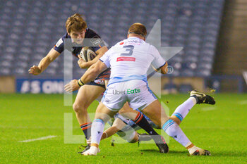 2020-11-09 - Chris Dean (12) of Edinburgh Rugby is tackled by Jason Tovey (10) and Dmitri Arhip (3) of Cardiff Blues during the Guinness Pro 14 rugby union match between Edinburgh Rugby and Cardiff Blues on November 9, 2020 at BT Murrayfield Stadium in Edinburgh, Scotland - Photo Malcolm Mackenzie / ProSportsImages / DPPI - EDINBURGH RUGBY VS CARDIFF BLUES - GUINNESS PRO 14 - RUGBY