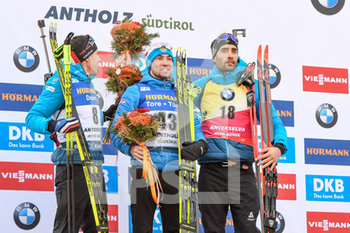 2020-02-15 - Il podio con Alexander Loginov (RUS), primo posto, Quentin Fillon Maillet (FRA), secondo posto e Martin Fourcade (FRA), terzo posto - IBU WORLD CHAMPIONSHIP BIATHLON 2020 - 10KM SPRINT MASCHILE - BIATHLON - WINTER SPORTS