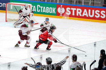 2021-05-21 - K. Rubins and O. Batna (Latvia) contrasting / check J. Bernard-Docker (Canada) - WORLD CHAMPIONSHIP 2021 - CANADA VS LATVIA - ICE HOCKEY - WINTER SPORTS