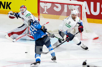 2021-05-22 - shot on goal by Bjorninen (FInland) defense by Petersen and Tennynson (USA)  - WORLD CHAMPIONSHIP 2021 - FINLAND VS USA - ICE HOCKEY - WINTER SPORTS