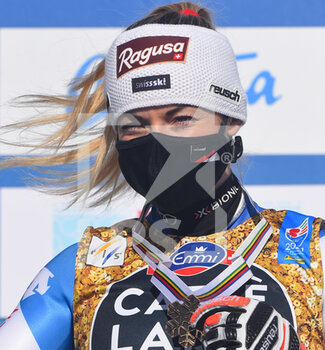 2021-02-13 - Suisse’s Lara Gut-Behrami smiles on the podium with her Bronze Medal - 2021 FIS ALPINE WORLD SKI CHAMPIONSHIPS - DOWNHILL - WOMEN - ALPINE SKIING - WINTER SPORTS