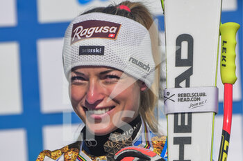 2021-02-13 - Suisse’s Lara Gut-Behrami smiles on the podium with her Bronze Medal  - 2021 FIS ALPINE WORLD SKI CHAMPIONSHIPS - DOWNHILL - WOMEN - ALPINE SKIING - WINTER SPORTS