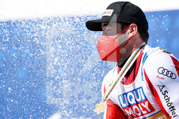 2021-02-14 - KRIECHMAYR Vincent AUT gold medal on the podium ceremony - 2021 FIS ALPINE WORLD SKI CHAMPIONSHIPS - DOWNHILL - MEN - ALPINE SKIING - WINTER SPORTS