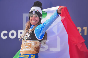 2021-02-16 - Italy‚Äôs Marta Bassino shows Italian flag after wins her Gold medal - 2021 FIS ALPINE WORLD SKI CHAMPIONSHIPS - PARALLEL GIANT SLALOM - WOMEN - ALPINE SKIING - WINTER SPORTS
