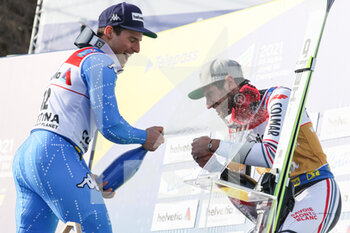 2021-02-19 - Podium celebration of the men's GS in Cortina d'Ampezzo with Mathieu FAIVRE (FRA) and Luca de ALIPRANDINI (ITA) - 2021 FIS ALPINE WORLD SKI CHAMPIONSHIPS - GIANT SLALOM - MEN - ALPINE SKIING - WINTER SPORTS