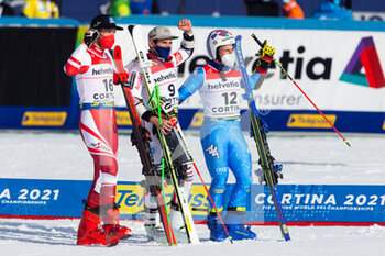 2021-02-19 - Marco Schwarz (AUT), Mathieu Faivre (FRA) and Luca De Aliprandini (ITA) celebrate after the race - 2021 FIS ALPINE WORLD SKI CHAMPIONSHIPS - GIANT SLALOM - MEN - ALPINE SKIING - WINTER SPORTS