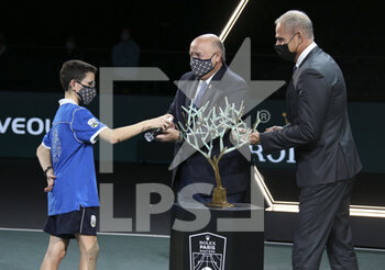 2020-11-08 - President of French Tennis Federation FFT Bernard Giudicelli and Director of the Rolex Paris Masters Guy Forget using hand sanitizer deliver by a ball boy before the trophy ceremony of the men's final on day 7 of the Rolex Paris Masters 2020, ATP Masters 1000 on November 8, 2020 at AccorHotels Arena in Paris, France - Photo Juan Soliz / DPPI - ROLEX PARIS MASTERS 2020, ATP MASTERS 1000 - MEN'S FINAL - INTERNATIONALS - TENNIS