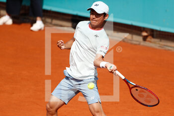 2021-05-01 - Yishihito Nishioka of Japan in action during his Men's Singles Qualifying match against Pablo Cuevas of Uruguay on the Mutua Madrid Open 2021, Masters 1000 tennis tournament on May 1, 2021 at La Caja Magica in Madrid, Spain - Photo Oscar J Barroso / Spain DPPI / DPPI - MUTUA MADRID OPEN 2021, MASTERS 1000 TENNIS TOURNAMENT - INTERNATIONALS - TENNIS