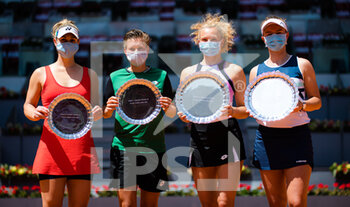 2021-05-08 - Gabriela Dabrowski of Canada and Demi Schuurs of the Netherlands and Katerina Siniakova, Barbora Krejcikova of the Czech Republic with their trophies after the doubles final of the Mutua Madrid Open 2021, Masters 1000 tennis tournament on May 8, 2021 at La Caja Magica in Madrid, Spain - Photo Rob Prange / Spain DPPI / DPPI - MUTUA MADRID OPEN 2021, MASTERS 1000 TENNIS TOURNAMENT - INTERNATIONALS - TENNIS