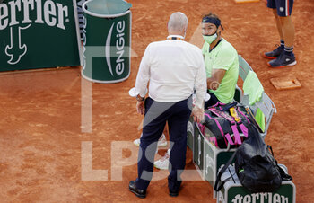 2021-06-11 - Rafael Nadal of Spain is talking about a medical time out during the semi-final against Novak Djokovic of Serbia at the Roland-Garros 2021, Grand Slam tennis tournament on June 11, 2021 at Roland-Garros stadium in Paris, France - Photo Nicol Knightman / DPPI - ROLAND-GARROS 2021, FRENCH OPEN 2021, A GRAND SLAM TENNIS TOURNAMENT - INTERNATIONALS - TENNIS