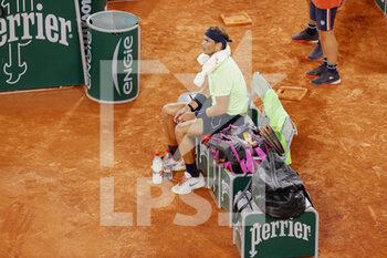 2021-06-11 - Rafael Nadal of Spain is talking is waiting for a medical time out during the semi-final against Novak Djokovic of Serbia at the Roland-Garros 2021, Grand Slam tennis tournament on June 11, 2021 at Roland-Garros stadium in Paris, France - Photo Nicol Knightman / DPPI - ROLAND-GARROS 2021, FRENCH OPEN 2021, A GRAND SLAM TENNIS TOURNAMENT - INTERNATIONALS - TENNIS