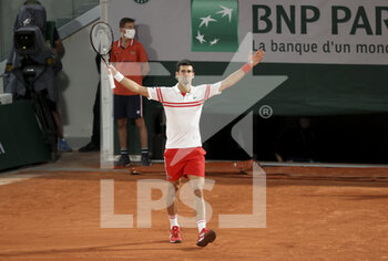2021-06-11 - Novak Djokovic of Serbia celebrates his semi-final victory against Rafael Nadal of Spain during day 13 of Roland-Garros 2021, French Open 2021, a Grand Slam tennis tournament on June 11, 2021 at Roland-Garros stadium in Paris, France - Photo Jean Catuffe / DPPI - ROLAND-GARROS 2021, FRENCH OPEN 2021, A GRAND SLAM TENNIS TOURNAMENT - INTERNATIONALS - TENNIS