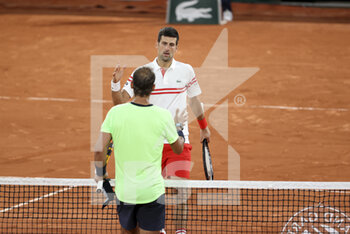 2021-06-11 - Novak Djokovic of Serbia shakes hands with Rafael Nadal of Spain after his semi-final victory during day 13 of Roland-Garros 2021, French Open 2021, a Grand Slam tennis tournament on June 11, 2021 at Roland-Garros stadium in Paris, France - Photo Jean Catuffe / DPPI - ROLAND-GARROS 2021, FRENCH OPEN 2021, A GRAND SLAM TENNIS TOURNAMENT - INTERNATIONALS - TENNIS