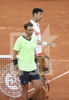 2021-06-11 - Novak Djokovic of Serbia shakes hands with Rafael Nadal of Spain after his semi-final victory during day 13 of Roland-Garros 2021, French Open 2021, a Grand Slam tennis tournament on June 11, 2021 at Roland-Garros stadium in Paris, France - Photo Jean Catuffe / DPPI - ROLAND-GARROS 2021, FRENCH OPEN 2021, A GRAND SLAM TENNIS TOURNAMENT - INTERNATIONALS - TENNIS