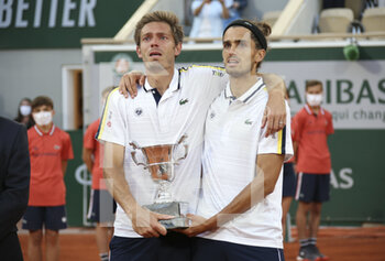 2021-06-12 - Winners Nicolas Mahut and Pierre-Hughes Herbert of France during the Men's Doubles final trophy ceremony on day 14 of Roland-Garros 2021, French Open 2021, a Grand Slam tennis tournament on June 12, 2021 at Roland-Garros stadium in Paris, France - Photo Jean Catuffe / DPPI - ROLAND-GARROS 2021, FRENCH OPEN 2021, A GRAND SLAM TENNIS TOURNAMENT - INTERNATIONALS - TENNIS