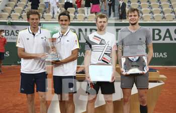2021-06-12 - Winners Nicolas Mahut and Pierre-Hughes Herbert of France, finalists Andrey Golubev and Alexander Bublik of Kazakhstan during the Men's Doubles final trophy ceremony on day 14 of Roland-Garros 2021, French Open 2021, a Grand Slam tennis tournament on June 12, 2021 at Roland-Garros stadium in Paris, France - Photo Jean Catuffe / DPPI - ROLAND-GARROS 2021, FRENCH OPEN 2021, A GRAND SLAM TENNIS TOURNAMENT - INTERNATIONALS - TENNIS