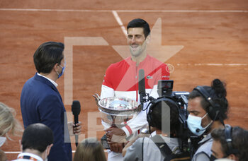 2021-06-13 - Winner Novak Djokovic of Serbia answers to the media following the men's final on day 15 of Roland-Garros 2021, French Open 2021, a Grand Slam tennis tournament on June 13, 2021 at Roland-Garros stadium in Paris, France - Photo Jean Catuffe / DPPI - ROLAND-GARROS 2021, FRENCH OPEN 2021, A GRAND SLAM TENNIS TOURNAMENT - INTERNATIONALS - TENNIS